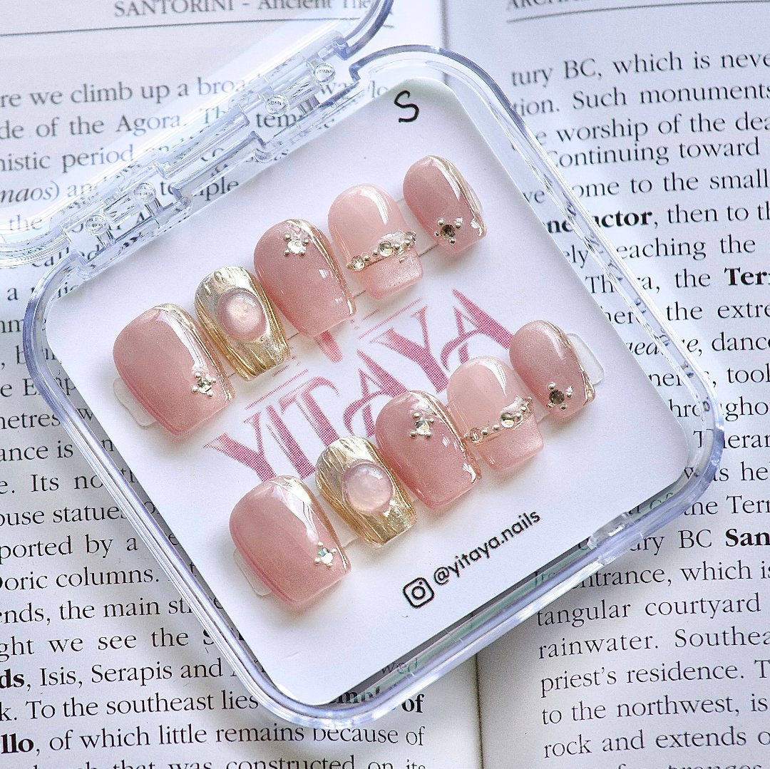 Blush Glamour Press On Nails, featuring soft pink hues with opulent gold accents and delicate crystals