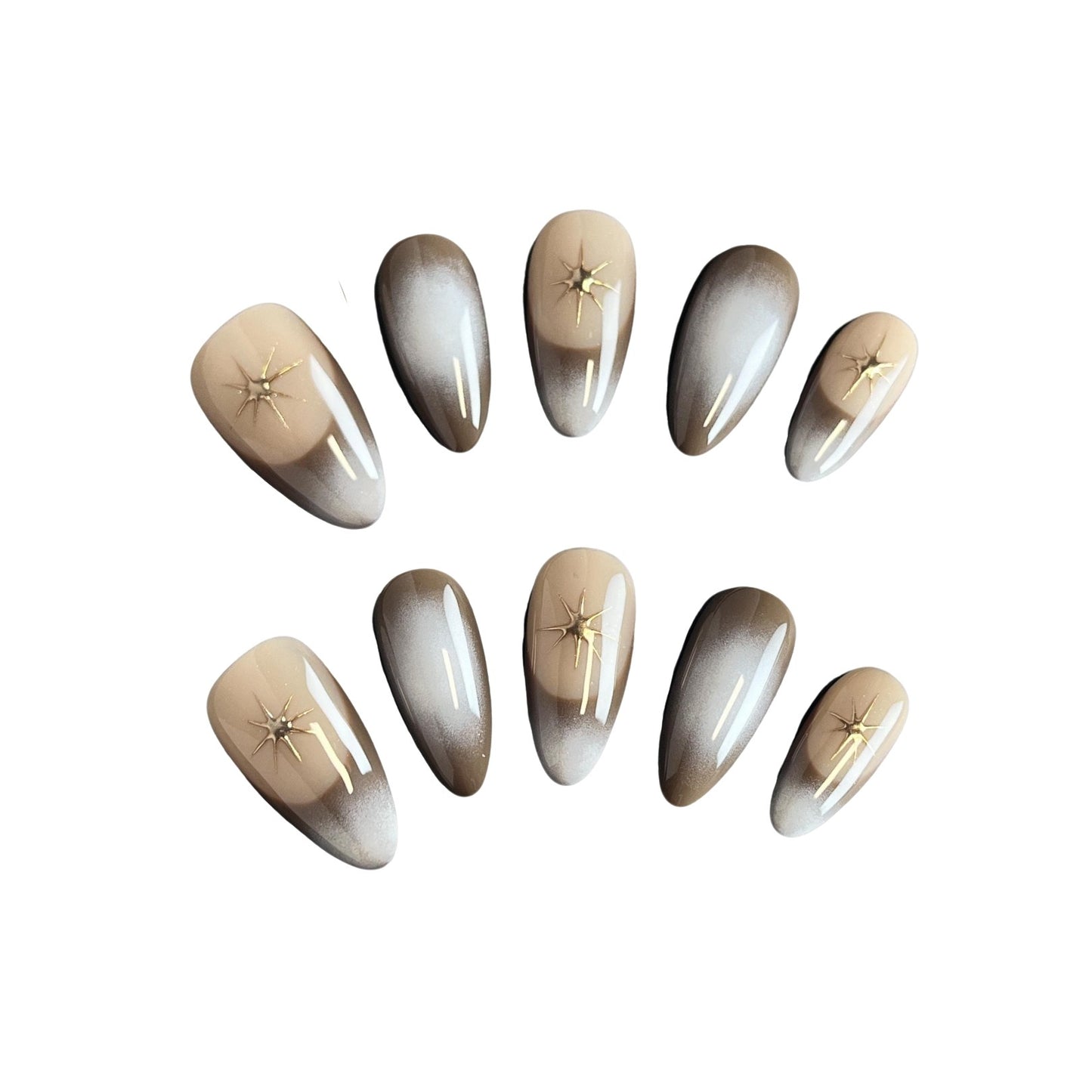 Eclipse Glow press on nails featuring a chic ombre gradient and delicate gold chrome stars