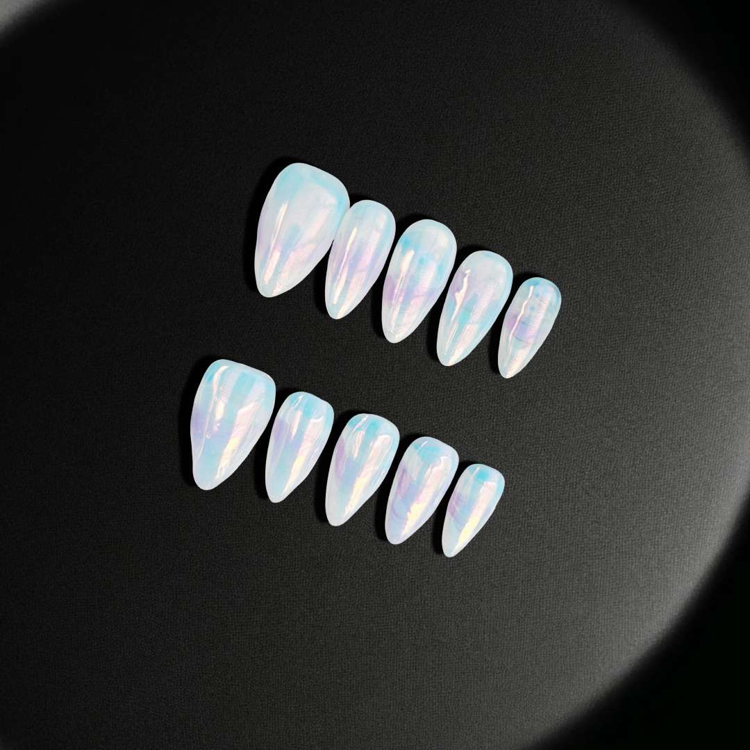 Enchanted Opal press-on nails from yitaya, shiny and in light pink and blue