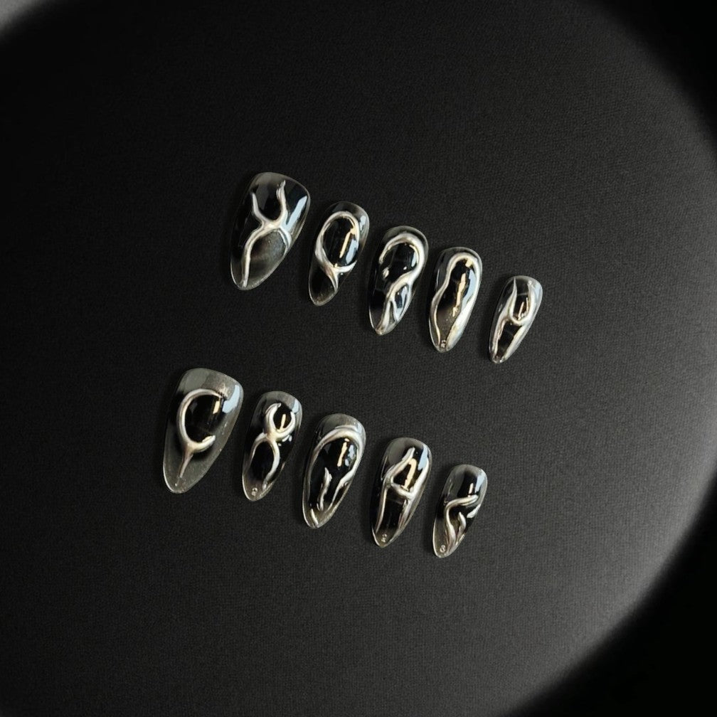 Midnight Mirage Handmade Press On Nails, glossy black base with intricate metallic silver accents