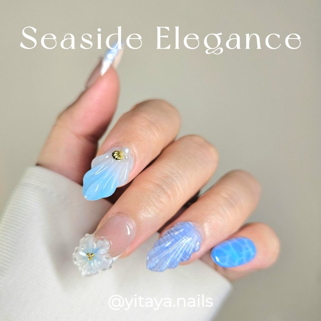 Seaside Elegancel Press On Nails from Yitaya Nails -- featuring a mesmerizing blend of soft blues and whites, adorned with crescent moons, stars, and clouds