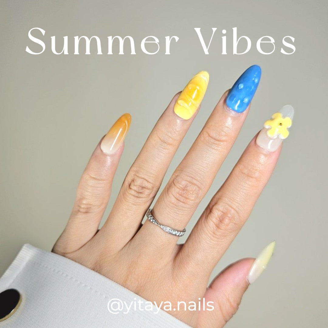 Summer Vibes Press On Nails from Yitaya Nails -- capturing the essence of summer with a beautiful gradient of blue and orange colors, reminiscent of the ocean and the setting sun
