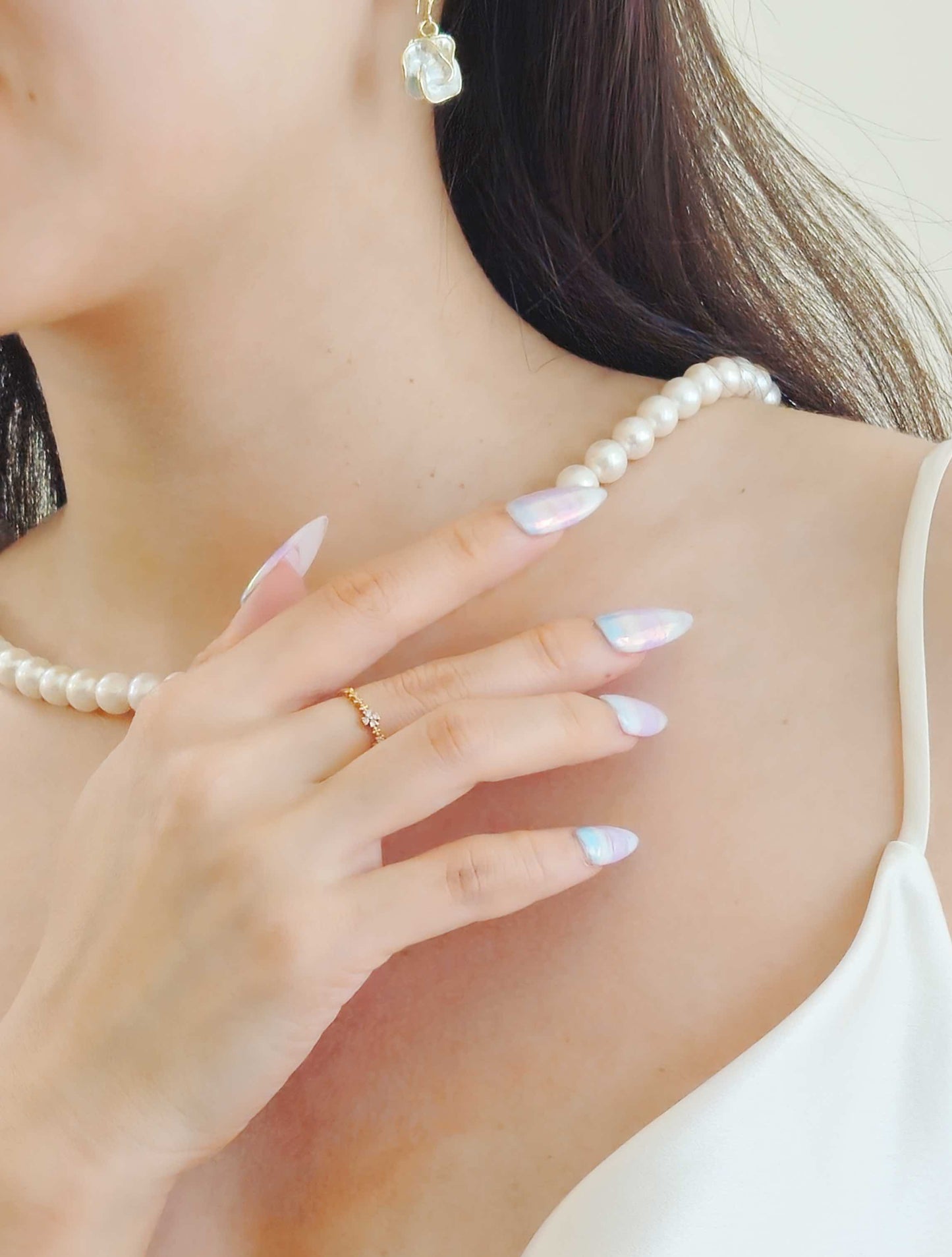 Enchanted Opal press-on nails from yitaya, shiny and in light pink and blue