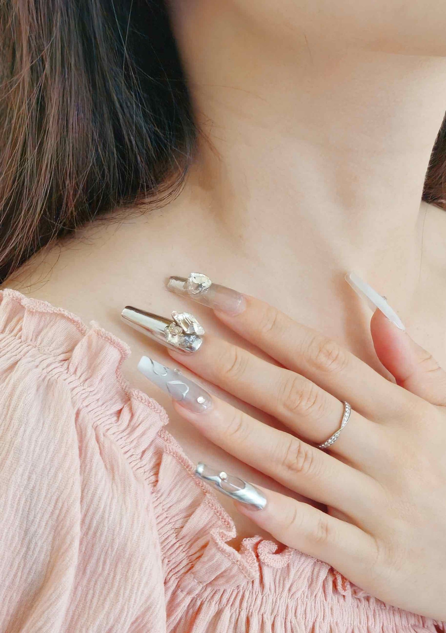 Girl hand with diamond long nails