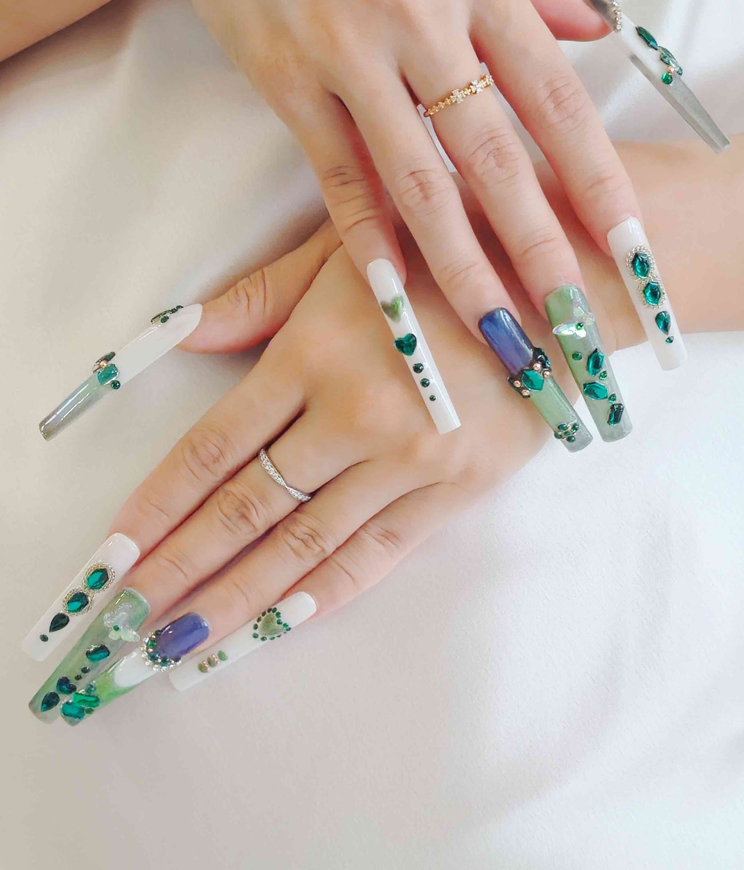 Cofin shaped press on nails, in white and green color with blue beads