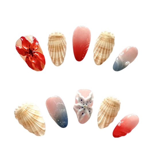 3D Coastal Bliss Press On Nails, feature exquisite shell details, soft ombré blues, corals, and delicate floral accents