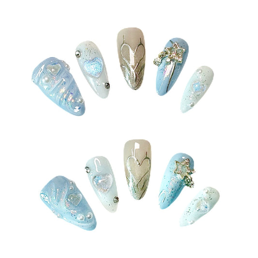 3D Ocean Breeze Artistic Press On Nails from Yitaya -- shimmering blue base adorned with snowflakes, stars, and pearls