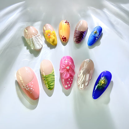 Handmade press on nails featuring vibrant colors, 3D pearl shell and floral designs, and a salon-quality finish.