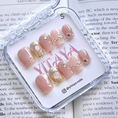 Blush Glamour Press On Nails, featuring soft pink hues with opulent gold accents and delicate crystals 