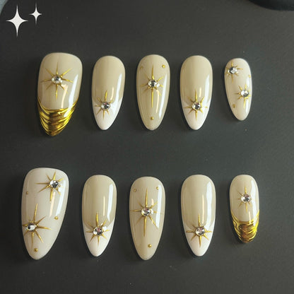 Celestial Gold Chrome press on nails, featuring dazzling gold chrome star set against a creamy, neutral base