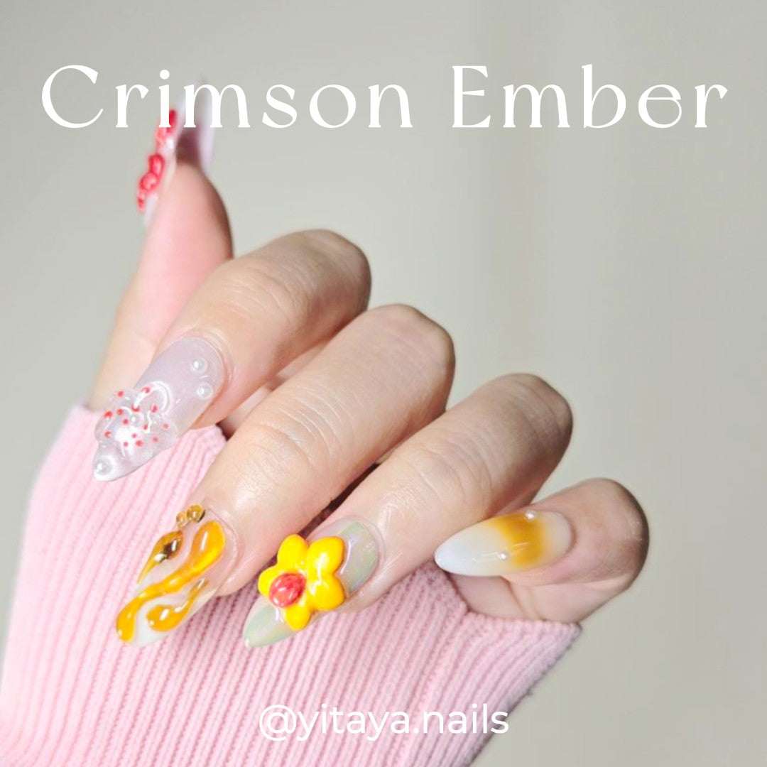 Crimson Ember Short Almond Press On Nails, with rich, warm tones of deep burgundy, burnt orange, and subtle gold accents
