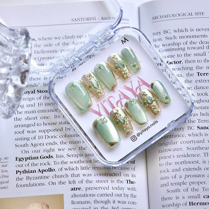 Emerald Dream Luxe press on nails, featuring a dreamy blend of soft sage green and shimmering metallic accents