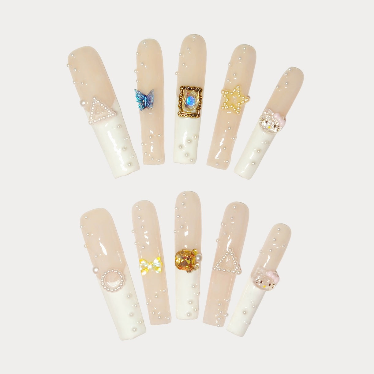 Ethereal Pearl Adornments Press On Nails, with a delicate blend of soft nude tones and creamy whites