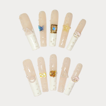 Ethereal Pearl Adornments Press On Nails, with a delicate blend of soft nude tones and creamy whites