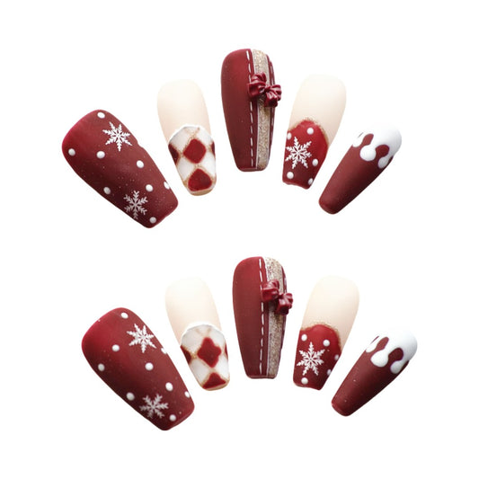 Holiday Cheer Couture press on nails, showcasing classic Christmas hues—rich reds, snowy whites, and cozy creams