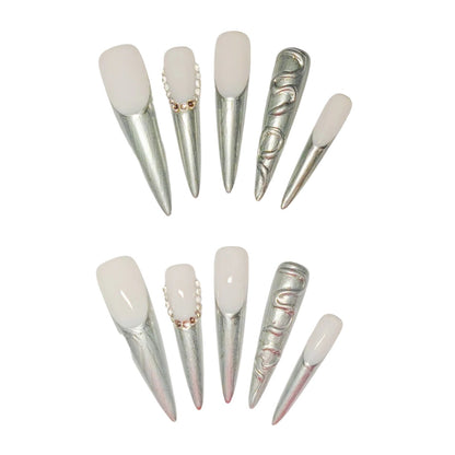 Metallic Elegance nail, featuring a sophisticated blend of a nude pink base with striking metallic silver tips.