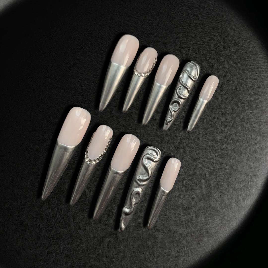 Metallic Elegance nail, featuring a sophisticated blend of a nude pink base with striking metallic silver tips.