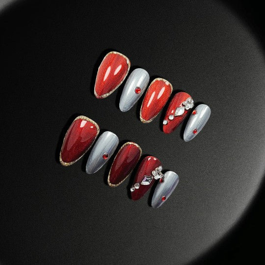 Scarlet Elegance Press-On Nails, featuring a burgundy base with shimmering silver accents and rhinestone