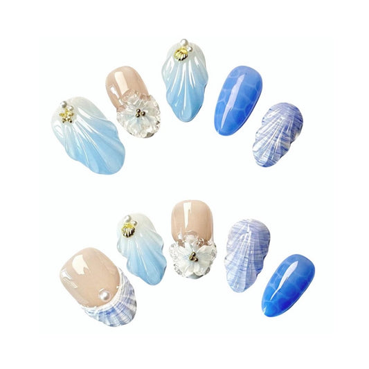 Seaside Elegancel Press On Nails from Yitaya Nails -- featuring a mesmerizing blend of soft blues and whites, adorned with crescent moons, stars, and clouds