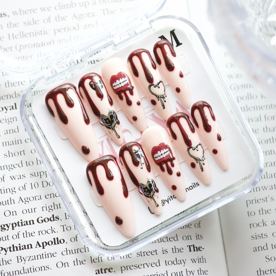 Vamp Drip Fantasy press on nails, featuring deep, blood-red drips, gothic hearts, and fang-inspired details