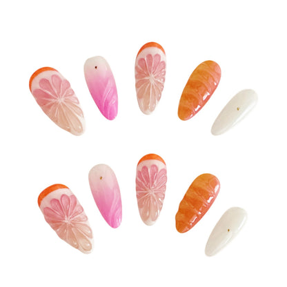 Yitaya Citrus Glow Press On Nails, featuring vibrant orange and pink hues with citrus-inspired designs