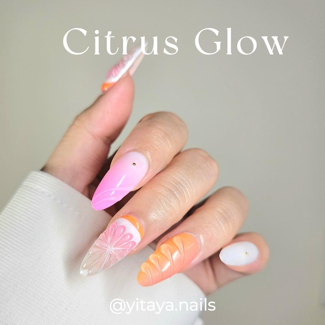 Yitaya Citrus Glow Press On Nails, featuring vibrant orange and pink hues with citrus-inspired designs