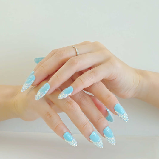 girl hands with blue press_on nails decorated with glasses from Yitaya