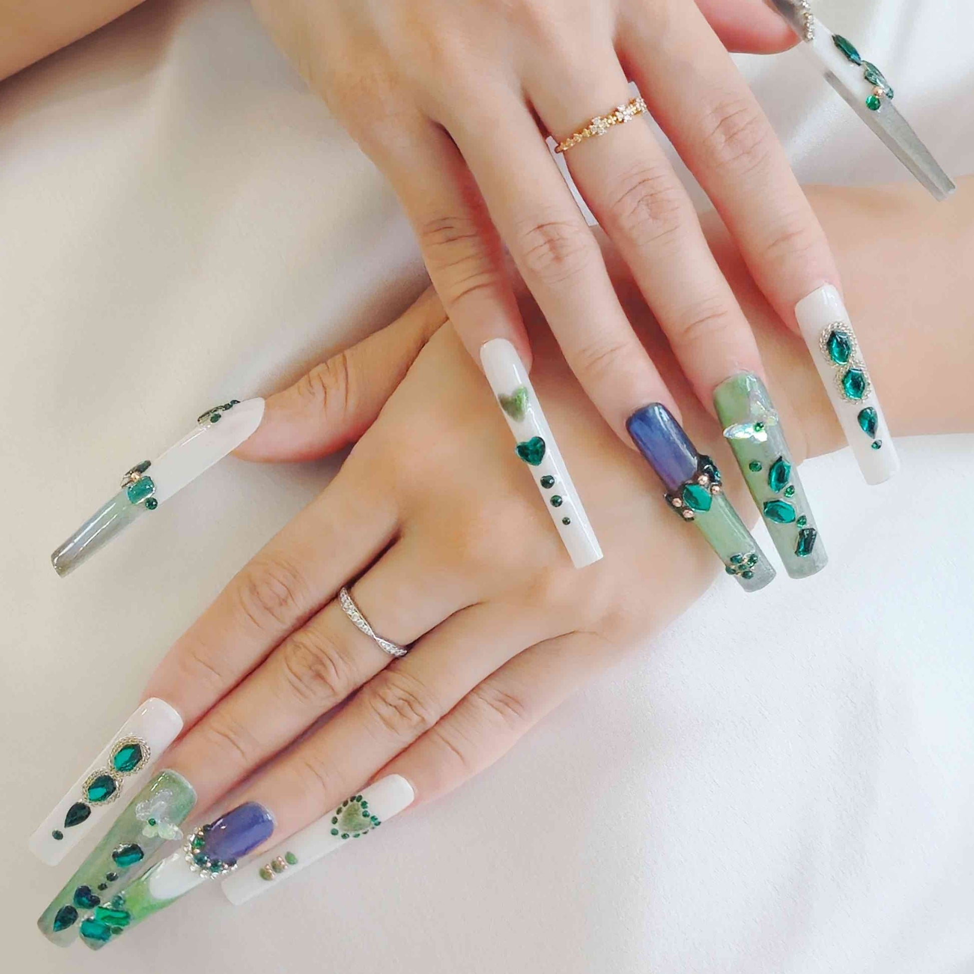 Enchanted Emerald Elegance press on nails, featuring a stunning combination of shimmering green and purple tones