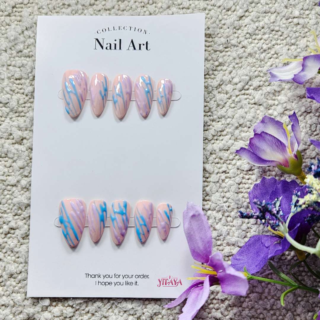 misty marble press on nails from Yitaya, in pink and baby blue